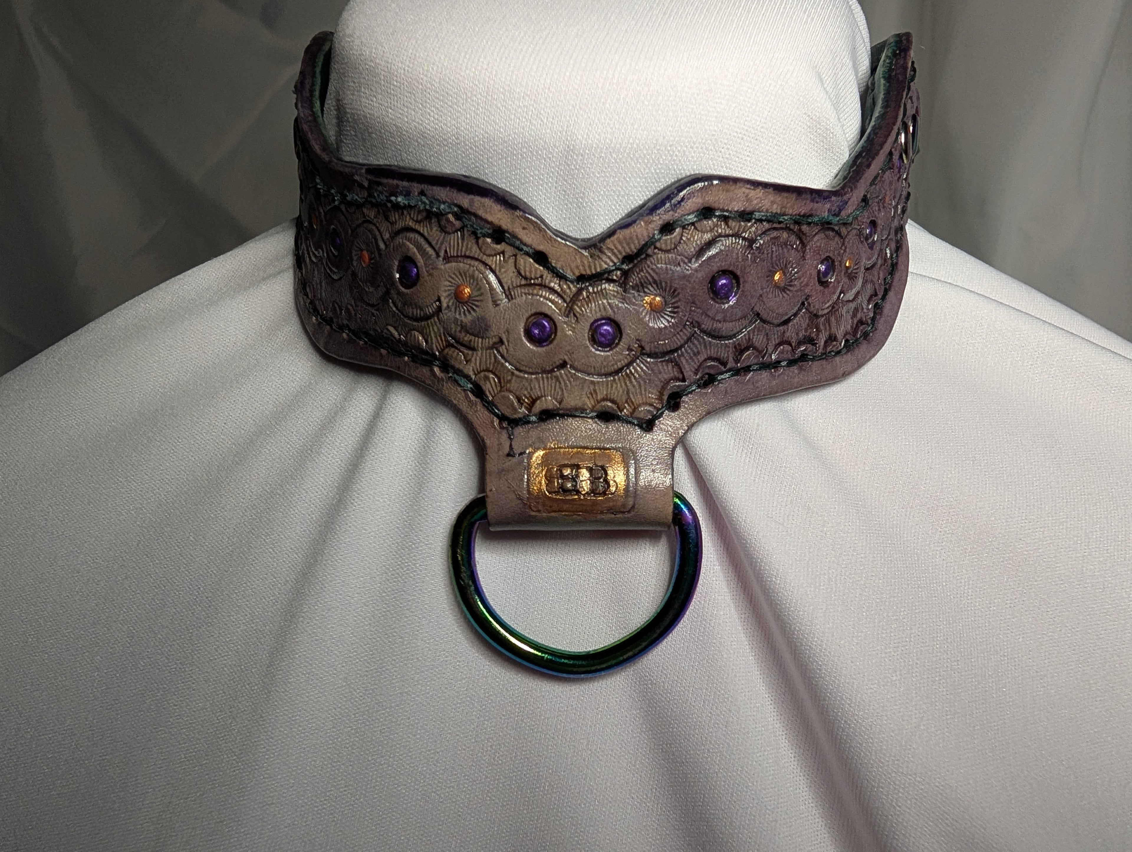 Leather "Rebel Collar" with "choke-her-chain" closure. Purple with green and rainbow plate hardware