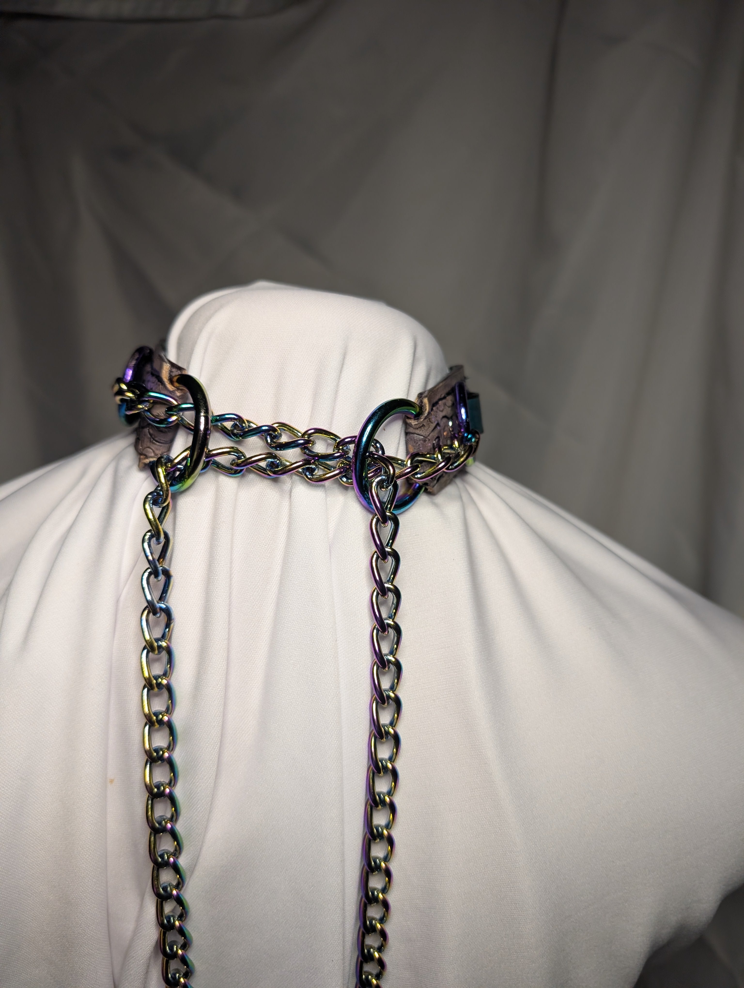 Leather "Rebel Collar" with "choke-her-chain" closure. Purple with green and rainbow plate hardware