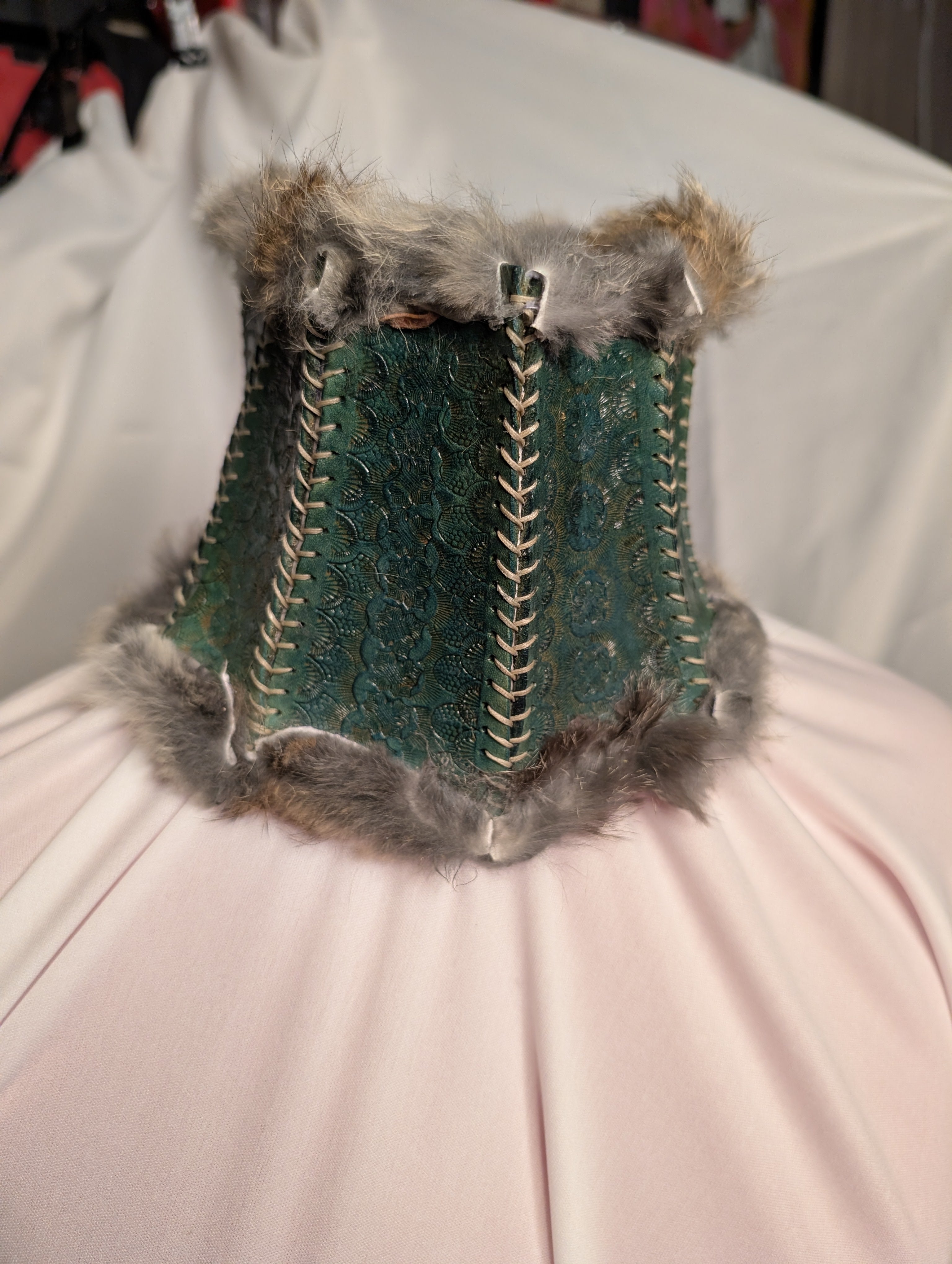 Posture collar, fur lined. Teal with black