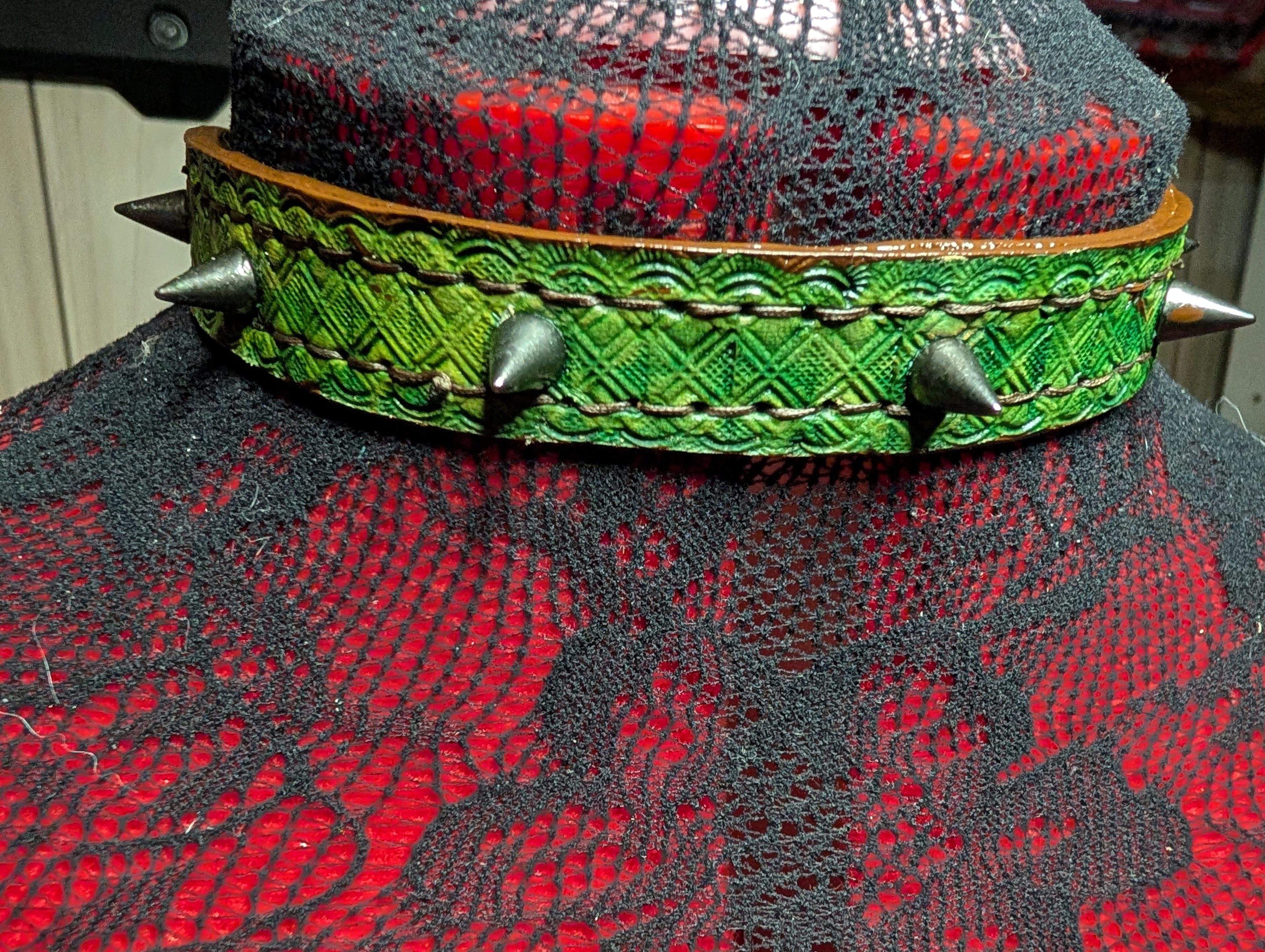 Slim buckled leather collar with spikes. Green with brown